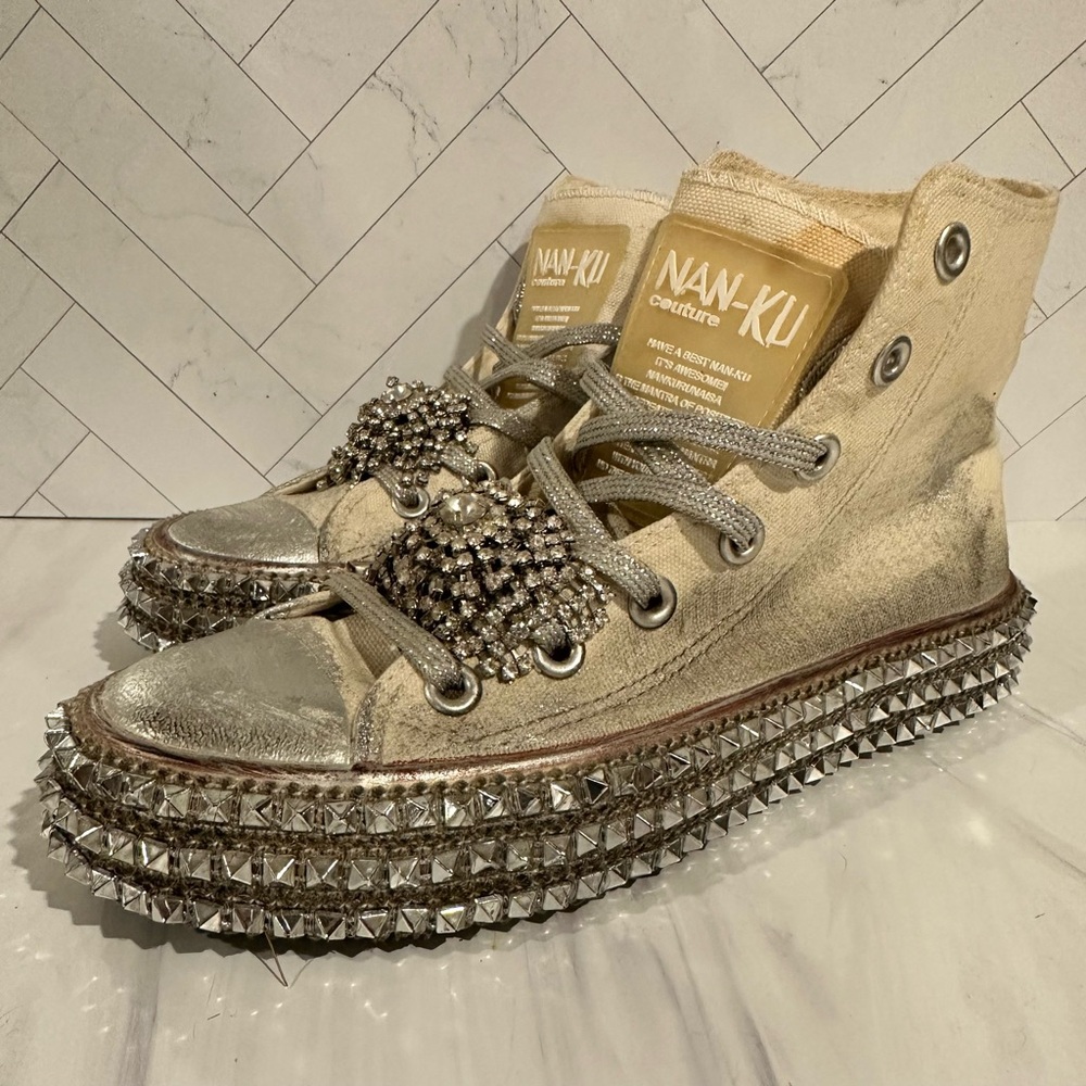 Nan Ku

Silver and Gold High-Top Sneakers with Studded Soles